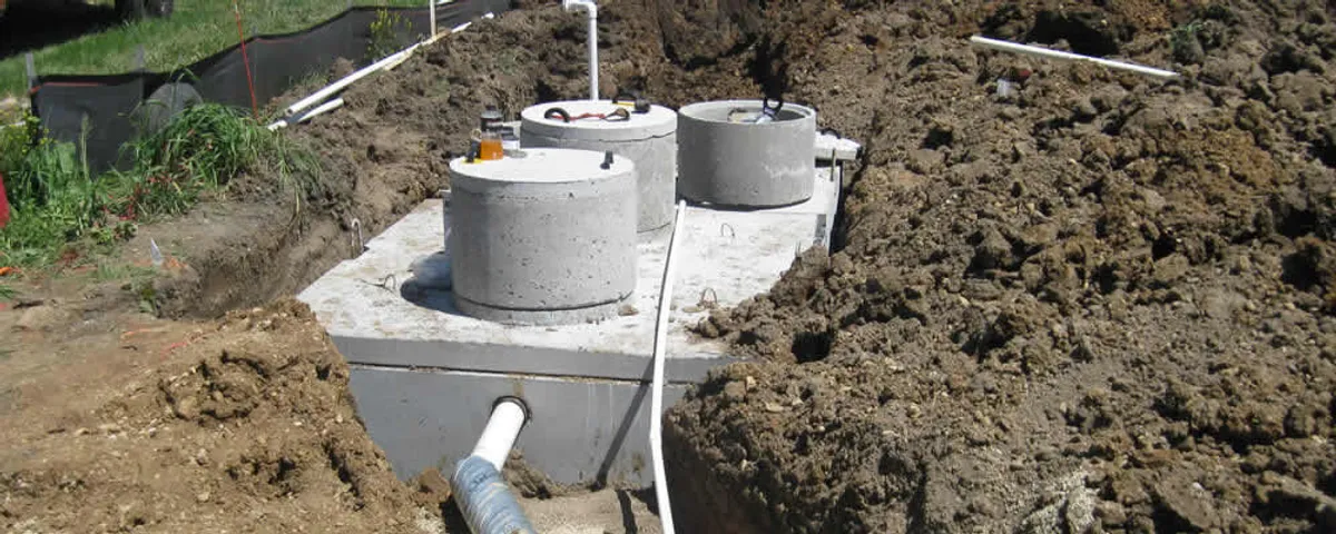 Septic system repair and installation site with tank access ports in Burlington, MA